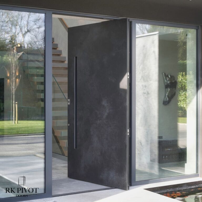 Drzwi Pivot - drzwi zewnętrzne pivot - drzwi Ossido Nero ceramiczne - spiekany kamień, wypuszczana klamka
