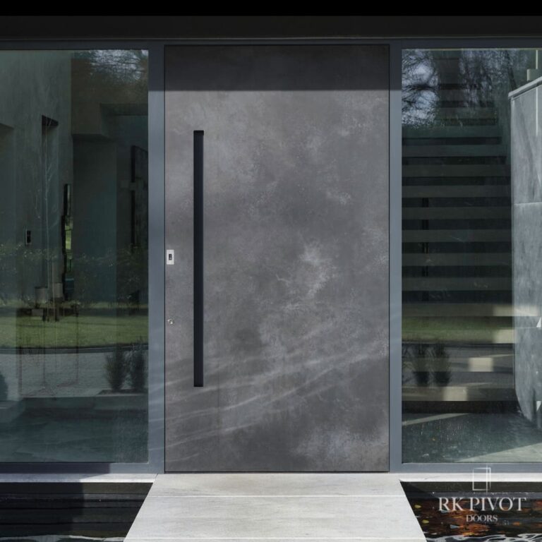 RK Pivot Doors - drzwi zewnętrzne pivot - drzwi Ossido Nero ceramiczne - spiekany kamień, wypuszczana klamka