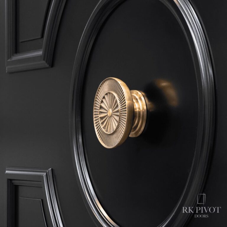 Drehtür - Invictus - goldener runder Handlauf - RK Pivot Doors